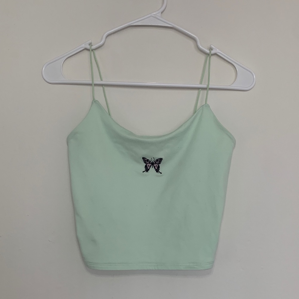 Small green spaghetti strap top with a cute little butterfly in the middle.